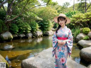 A woman in a kimono is posing for the camera.